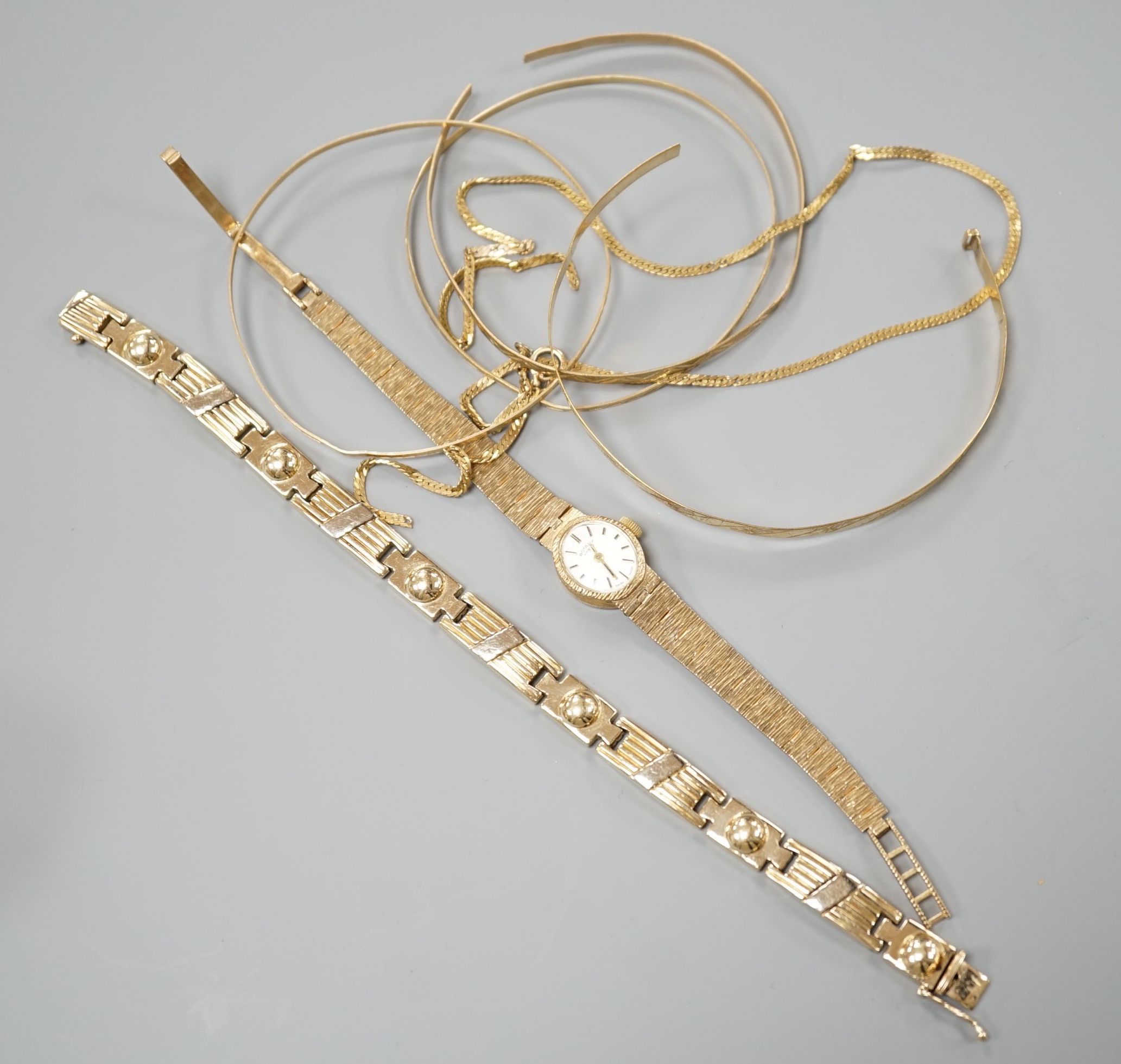 A lady's 9ct gold Rotary manual wind wrist watch on 9ct bracelet, gross 15.4 grams, five damaged 9ct gold items, 15 grams and a 585 yellow metal bracelet, 29.5 grams.